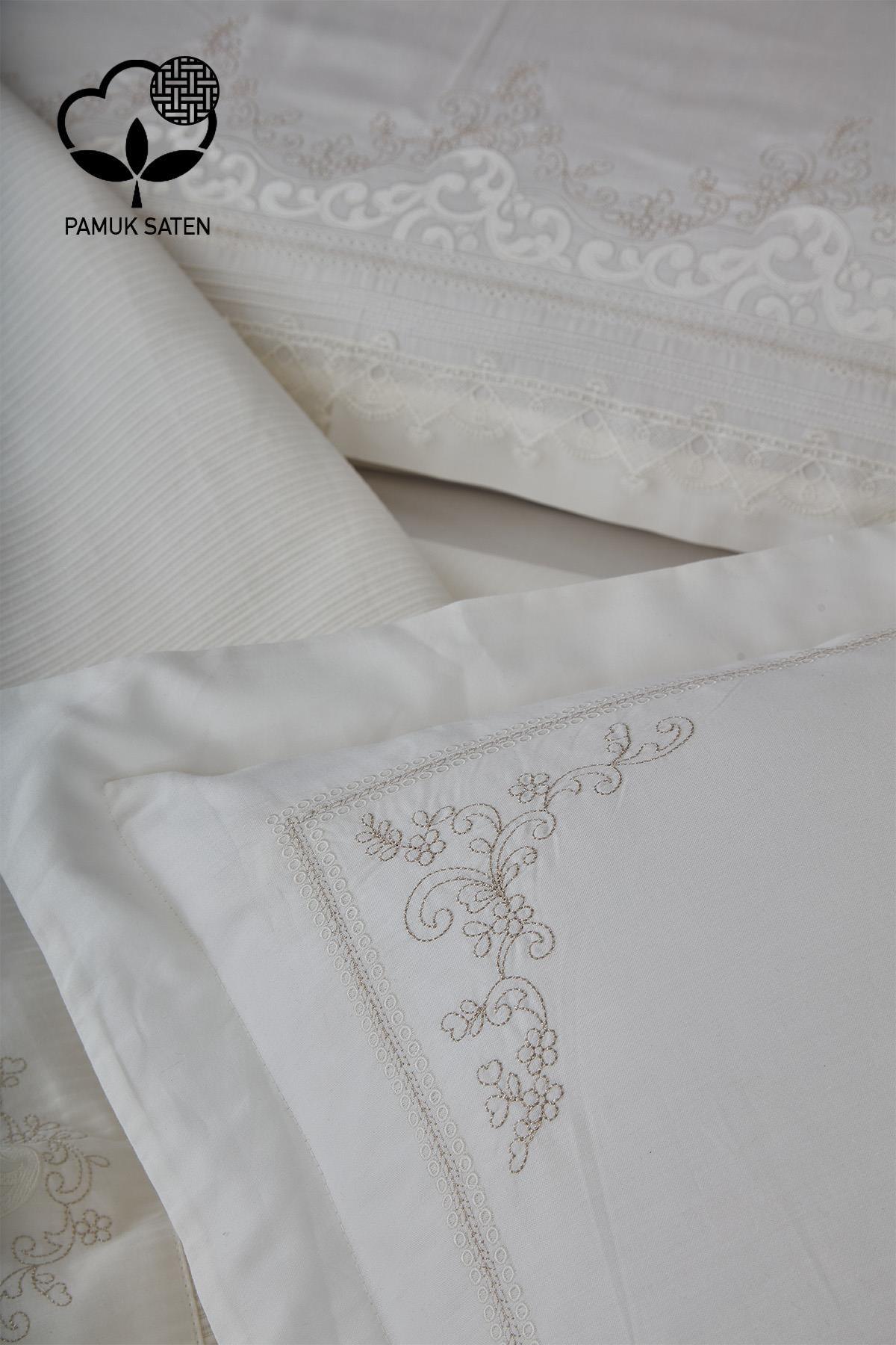 Dettagli del set copripiumino e copriletto matrimoniale in raso di cotone bianco con ricami color rubino